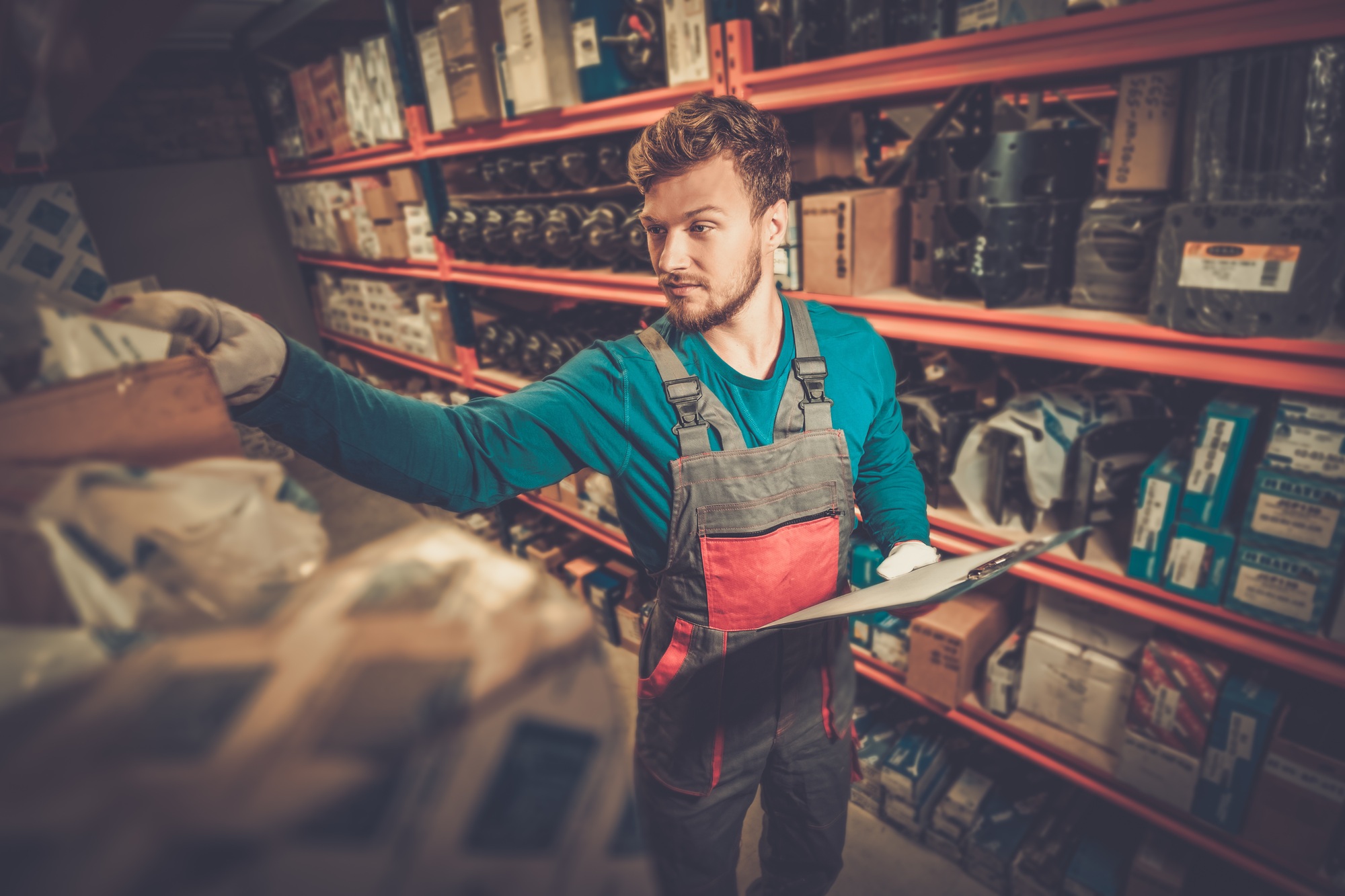 Worker on a automotive spare parts warehouse
